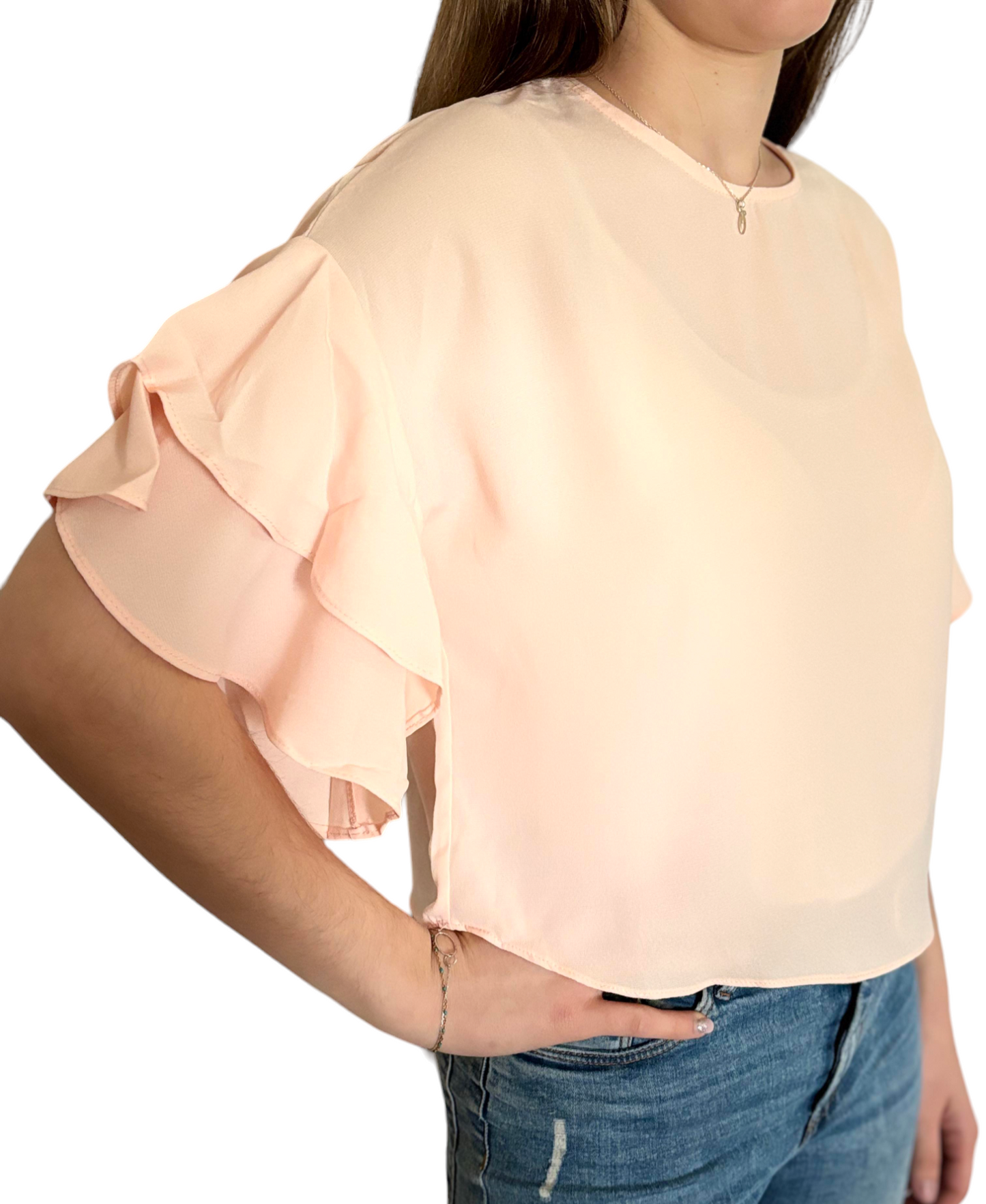 Blouse rose avec volants aux manches