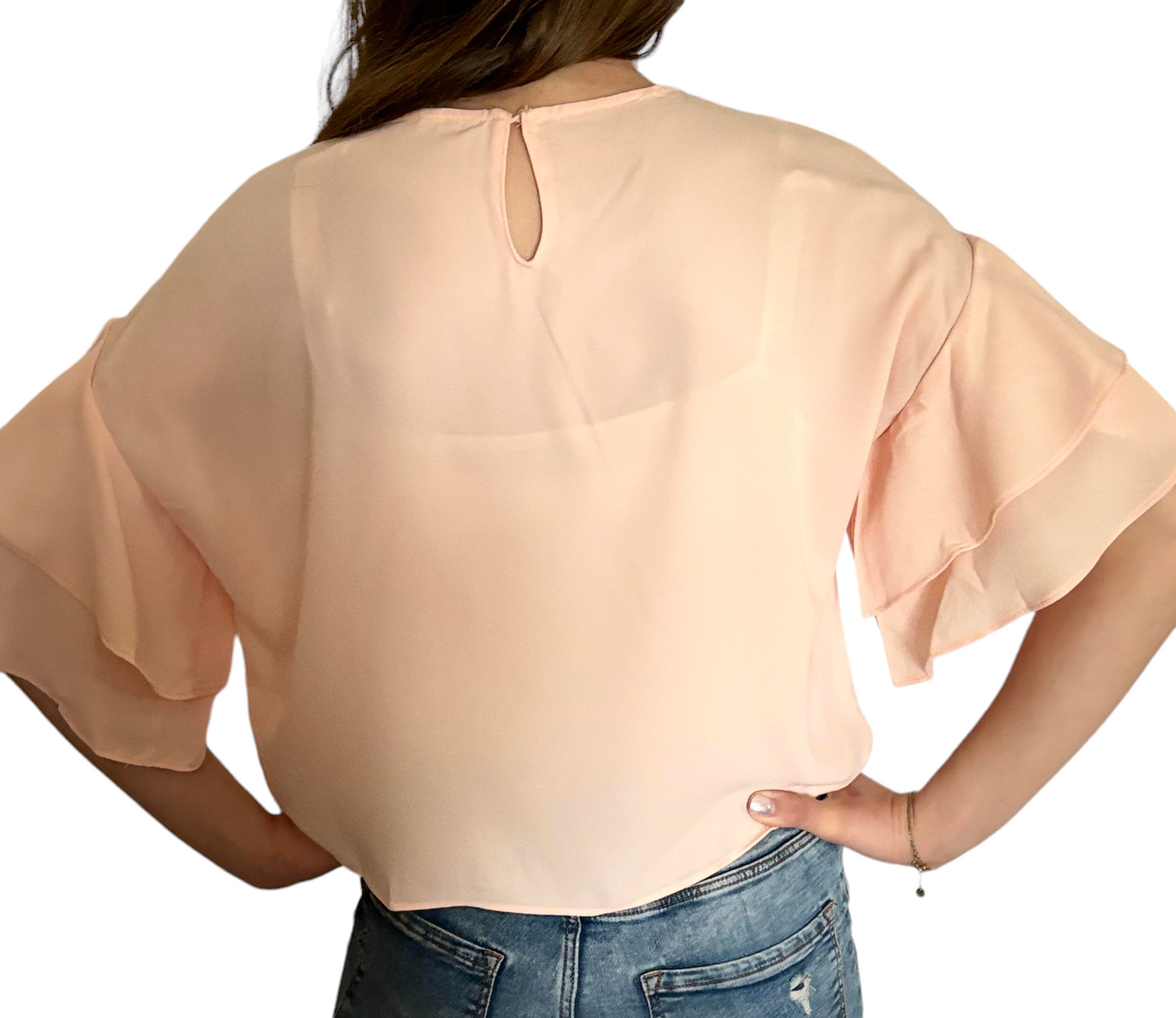 Blouse rose avec volants aux manches